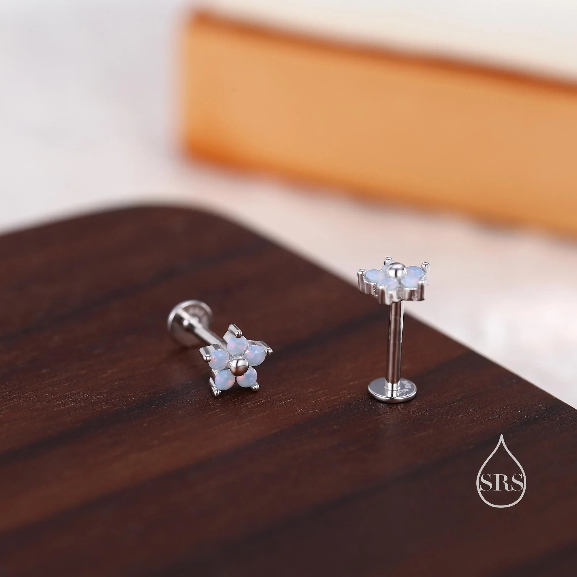 Vue alternative de Tiny Opal Blue CZ Flower 16G Internally Threaded Flat Back Earrings in Sterling Silver