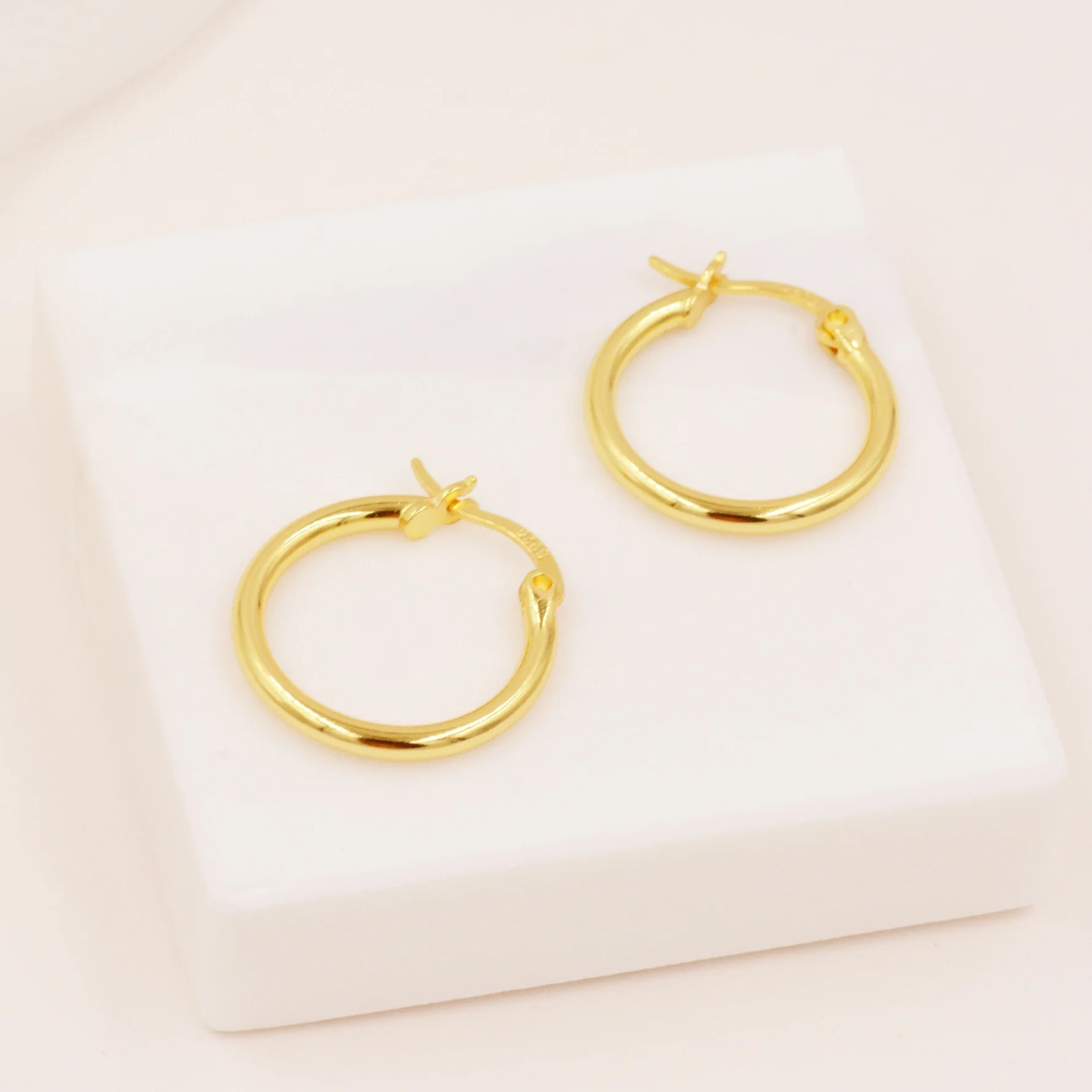 Pair of Minimalist Huggie Hoop Earrings - Image 7